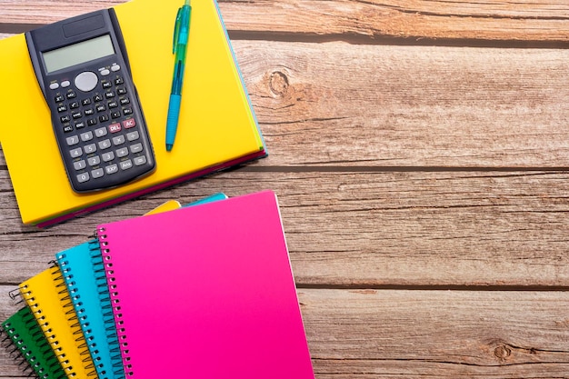 Back to class school supplies on wooden table