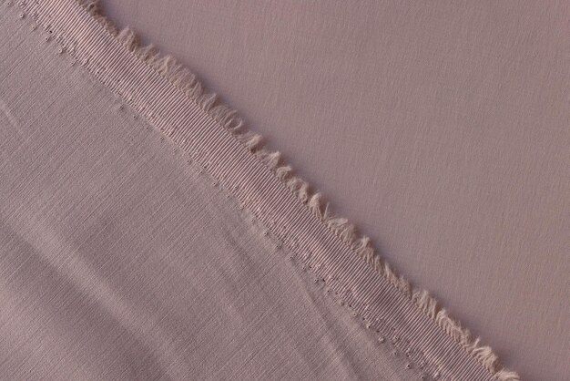 Back and face sides of greypink textile close up cutted greypink fabric as background