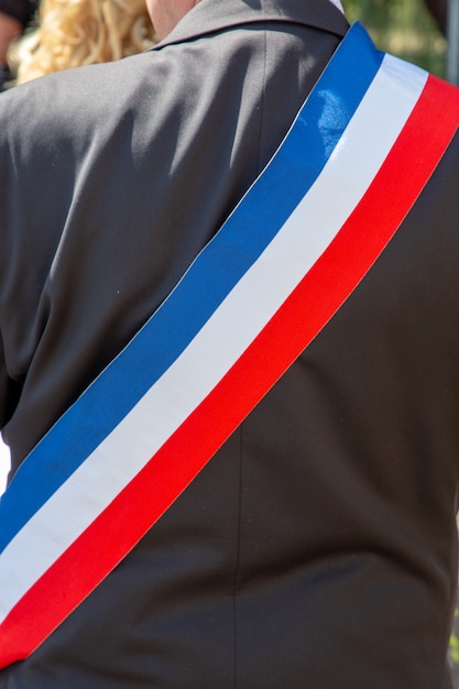 Photo back french mayor during a celebration with scarf