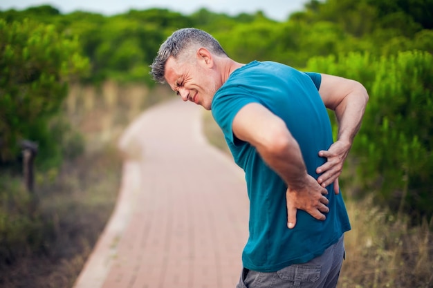 Back pain Man with back injury Healthcare and medicine concept