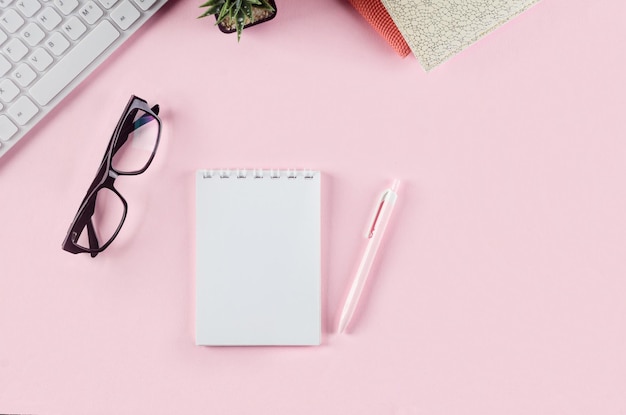 Back to school concept Pencil case with school stationery on pink  Keyboard notebook paper