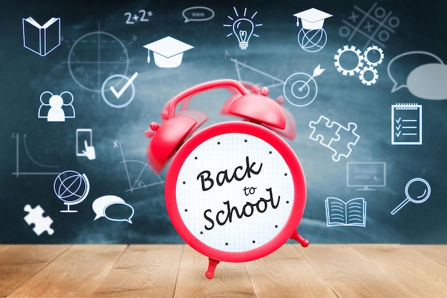 back to school concept, red alarm clock and digital holograms on chalkboard background