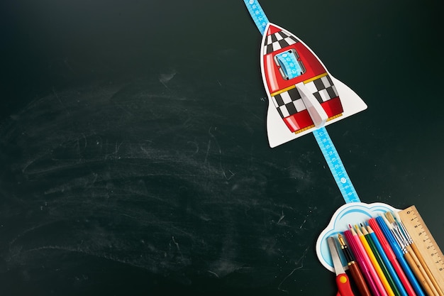 Back to school creative banner rocket ship launch with pencils