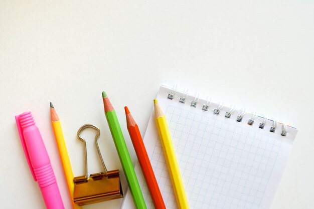 Back to school. Items for the school on a white table with copy space