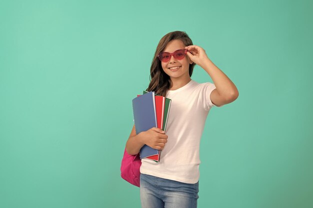 Back to school knowledge day education kid in glasses hold copybook september 1