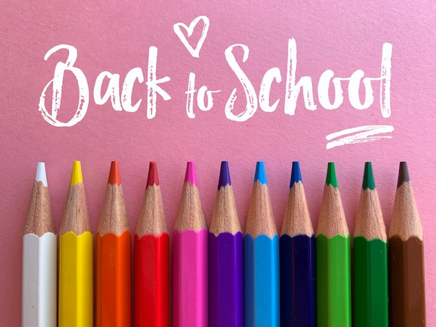 Back to school, pencils in pink background