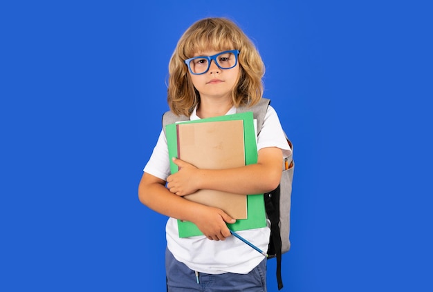 Back to school schoolboy with school bag hold book and copybook ready to learn school children on is