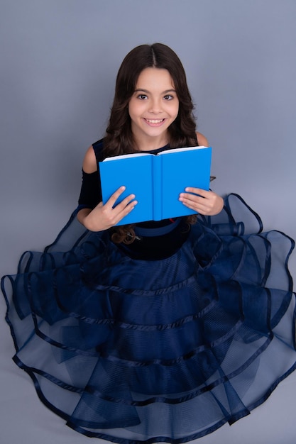 Back to school Teenager schoolgirl hold book and copybook ready to learn School children on isolated grey background Happy face positive and smiling emotions of teenager schoolgirl