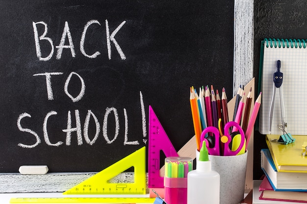 Back to School Text. School Stationary and Blackboard.