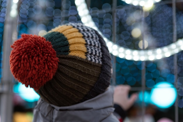 Back view of boy looking at christmas tree and christmas decorations