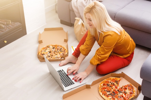 Back view of business woman talking to her colleagues about plan in video conference. Multiethnic business team using laptop for a online meeting in video call. Group of people smart working from home