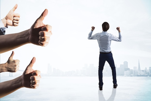 Back view of happy european businessman with thumbs up celebrating success on light city background Happiness and successful entrepreneur concept