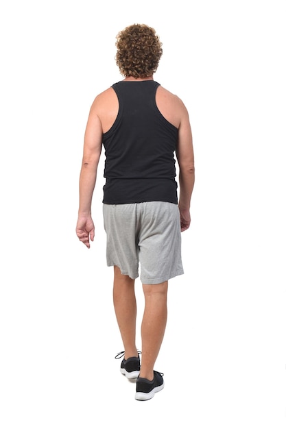 Back view of a man with sportswear walking on white background