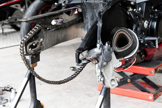 Back view motorcycle up to stand to remove wheel to change tire