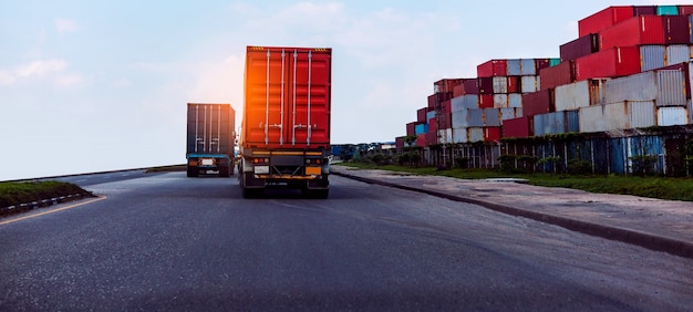 Back view of red container truck in ship port logistics.transportation industry in port terminal