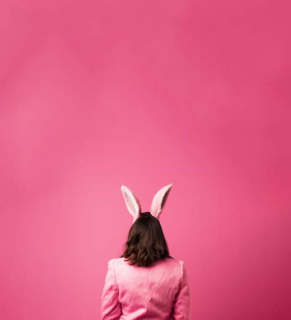 Back view of a woman wearing bunny ears