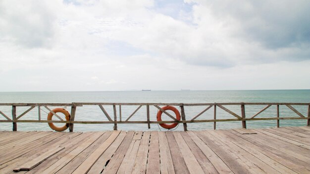 Photo backdrop wooden fence and boardwalk or piers at the beach