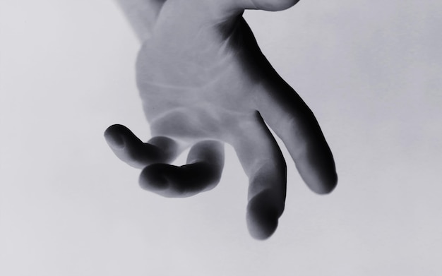 Photo background abstract gestures with fingers black hands on a white background gesticulation with hands