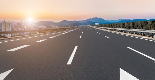 Background of asphalt pavement and urban architectural landscape skyline