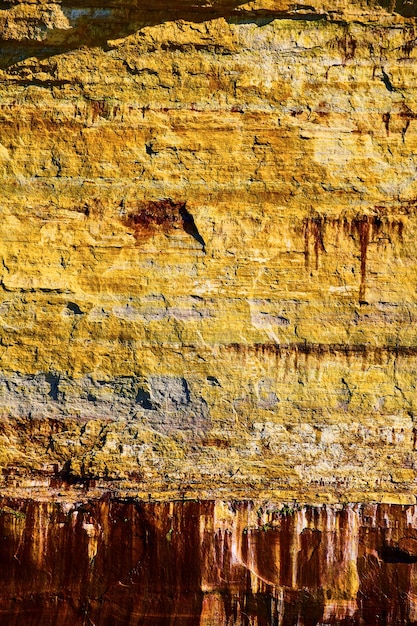 Background asset yellow and rusty red drip down Pictured Rocks cliff wall like paint