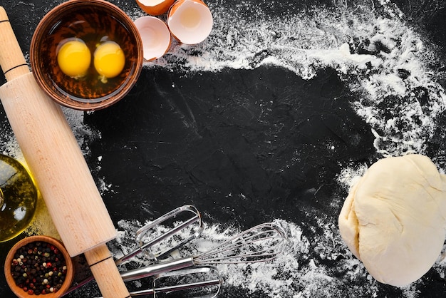 The background of baking rolling pin flour egg dough Top view Free copy space