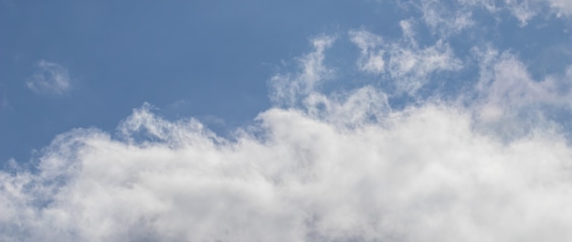 Background of blue sky with white clouds