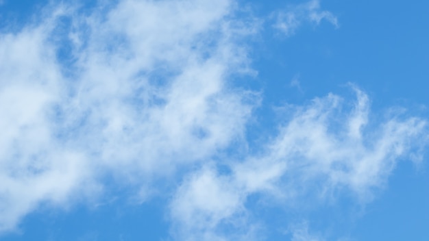 Background of blue sky with white clouds