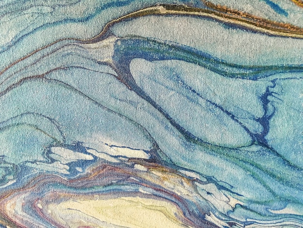 Background of blue splashes of paint. Fragment of artwork