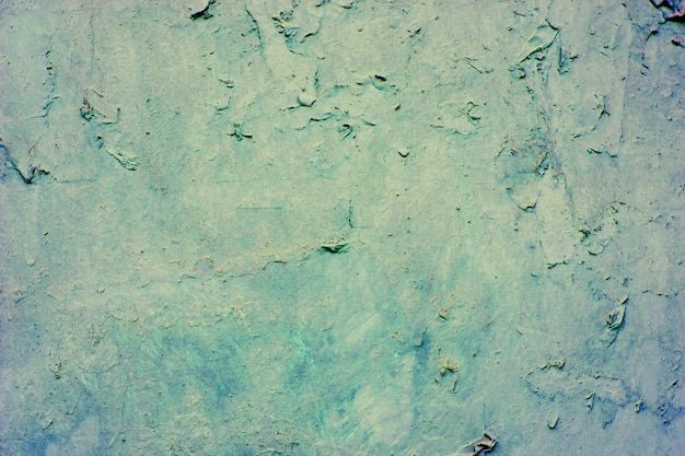 Background of a blue stucco coated and painted exterior, rough cast of cement and concrete wall texture