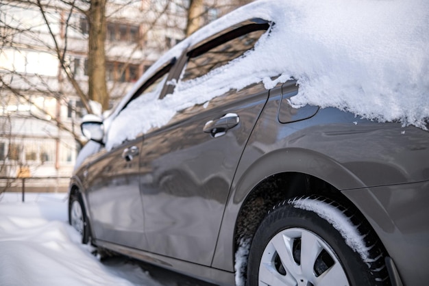 Background blur out of focus bokeh Car parked in row at outdoor parking in winter