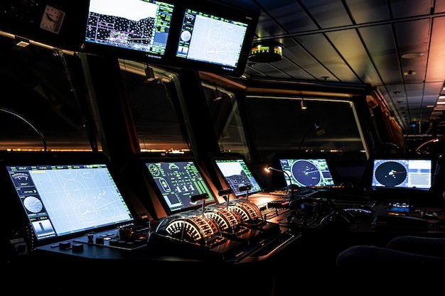 Background, blur, out of focus, bokeh. The wheelhouse of a modern ship is a close-up of the ship's course control levers.