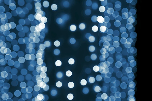 Background blurred abstraction of colored lanterns and decorations. bokeh texture of street colored lights