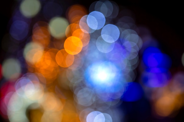 background blurred abstraction of colored lanterns and decorations. bokeh texture of street colored lights