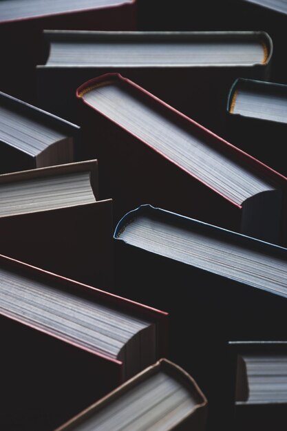 Background of books in hardcovers full-frame texture vertical shot