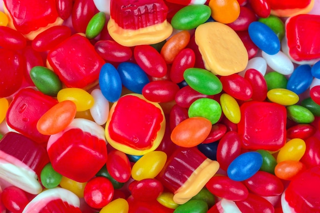 Background of colorful candies in different shapes