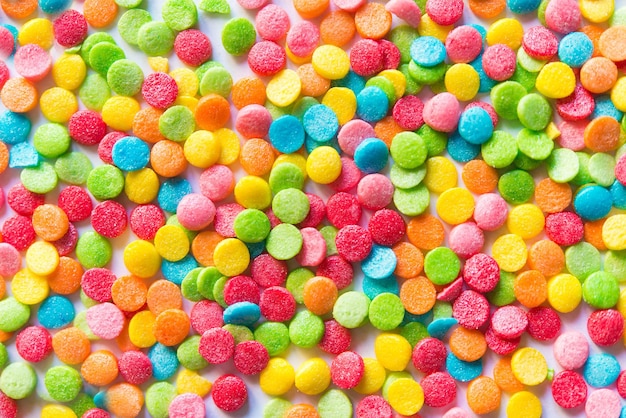 Background of colorful candies. Rainbow topping for topping ice cream and cakes. top view.