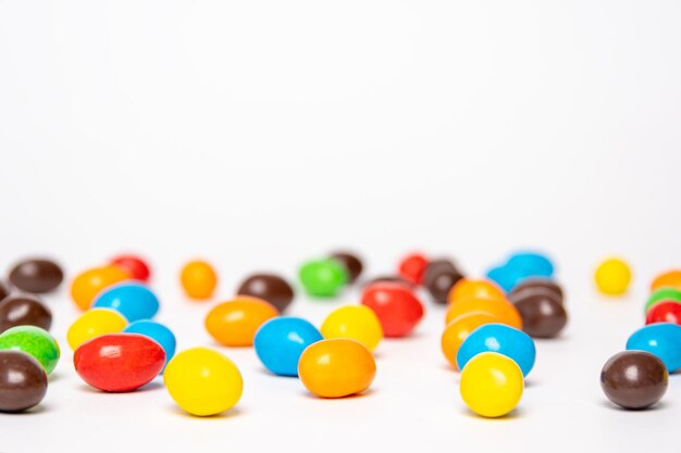 Background of colorful rainbow round candies copy space selective focus Treats for children Sweets lollipops based on sugar