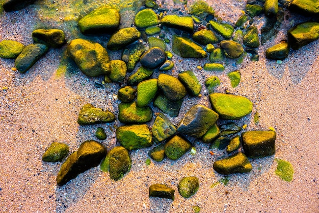 Background of colorful rocks by the sea.