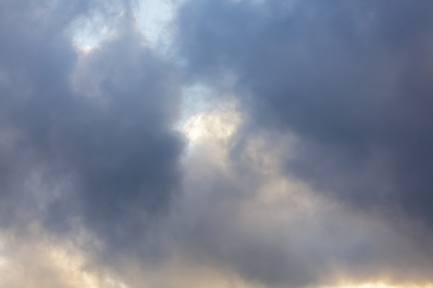 The background consists of large gray clouds in sky before heavy rain natural background weather for...