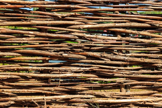 Background of the decorative rustic village wicker fence