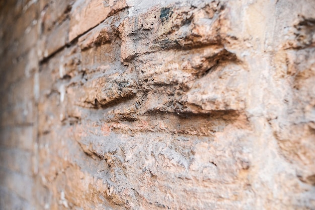 Background for designers antique brick texture. Brick wall texture in daylight. Many bricks.