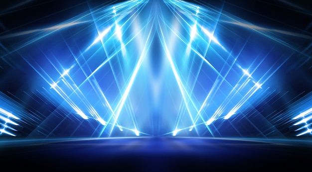 Background of empty stage show. Neon light and laser show. Laser futuristic shapes on a dark background. Blue neon light, symmetrical reflection.