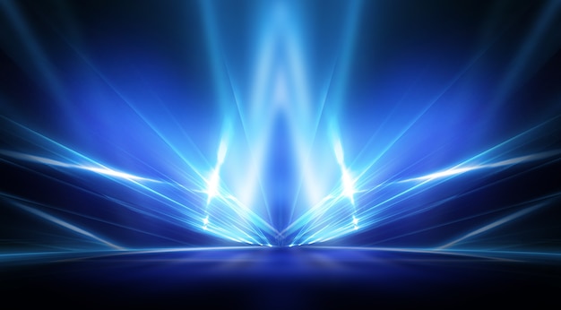 Background of empty stage show. Neon light and laser show. Laser futuristic shapes on a dark background. Blue neon light, symmetrical reflection.