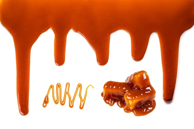 Photo background of flowing caramel sauce isolated on white copy space