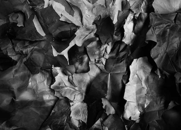 Background of fragments of crumpled paper black and white