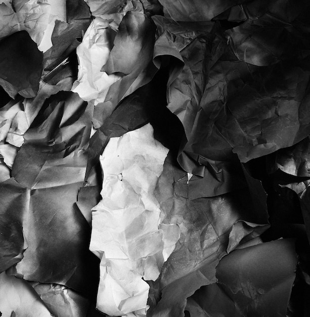 Background of fragments of crumpled paper black and white