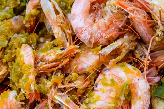 Background of the fresh boiled king shrimps with the oriental herbs