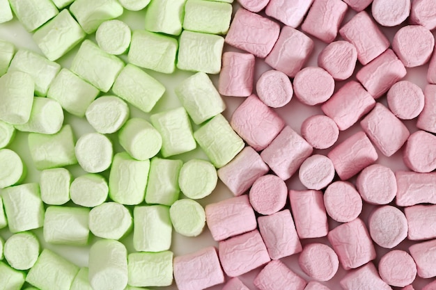 Background from bright green and pink mini marshmallow Sweet zephyr