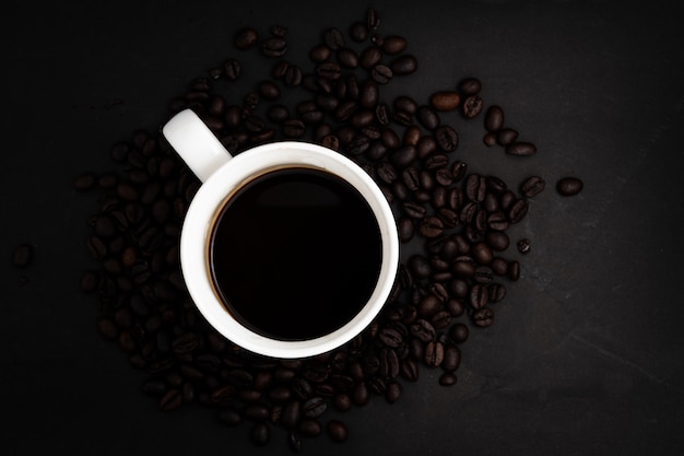 Background From Coffee Grains And A Cup From Coffee, The Top View