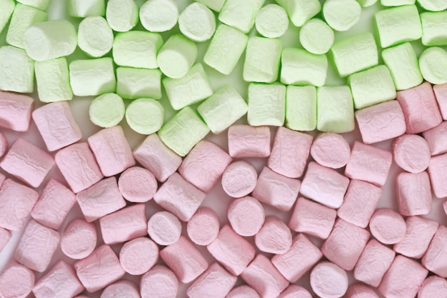 Background from colorful zephyr Green and pink small candy marshmallow